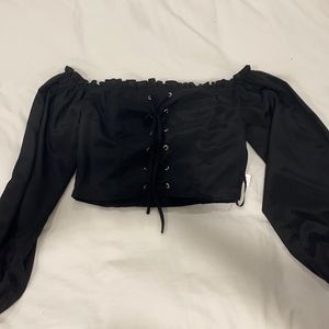 Super down cropped black top with lace up middle. Brand new.